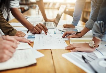 Business,People,,Collaboration,And,Paperwork,With,Hands,,Statistics,And,Social