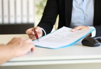 Close,Up,Of,An,Executive,Hands,Holding,A,Pen,And