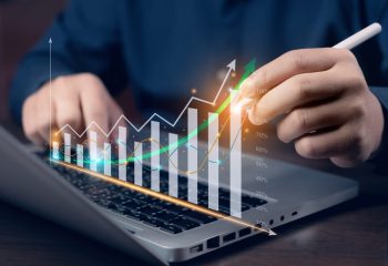 A,Businessman,Investor,Analyzes,The,Profitability,Of,Working,Companies,With