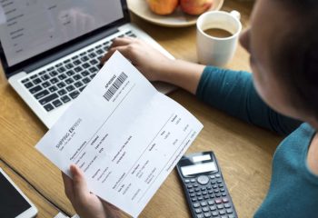 Woman checking shipping letter
