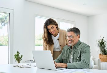 Smiling,Middle,Aged,Senior,Man,Working,On,Computer,Sitting,At