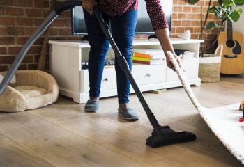 Black woman is cleaning room