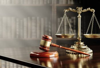 Legal concept: Scales of justice and and the judge's gavel hammer as a symbol of law and order.