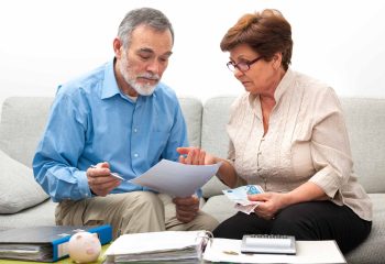 senior couple worrying about their money situation