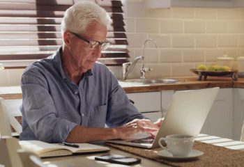 Laptop,,Senior,Man,And,Working,In,Kitchen,On,Retirement,Plan,