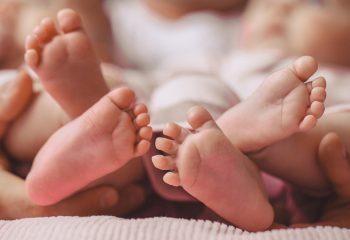 Baby,Feet,In,Mother,Hands.,Tiny,Newborn,Baby's,Feet,On