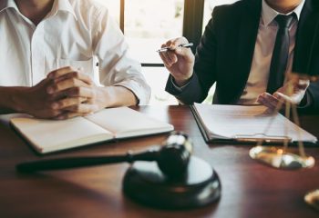 Lawyer explained to the client about the law that must be brought against the court case.