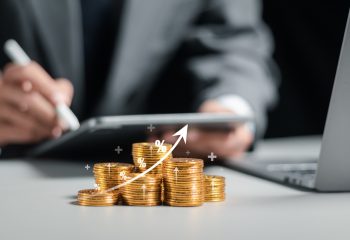 Businessman collecting coins with profit chart analysis business growth, profit growth management and corporate financial statistics. finance and investment concept.